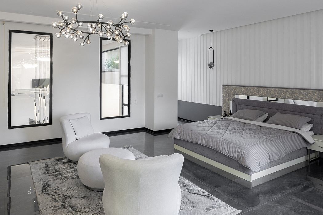 Elegant modern bedroom with sleek lighting fixtures, plush furnishings, and luxurious tiled floor.