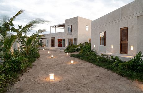 Expansive contemporary architectural design with lush tropical landscaping.