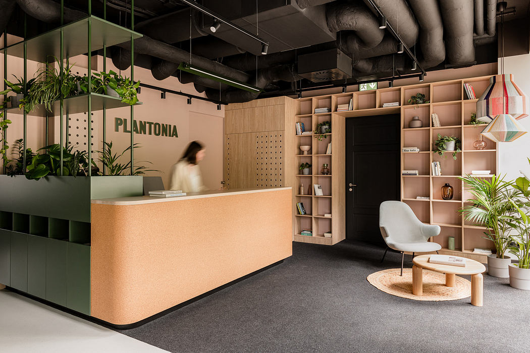 A modern office reception with sleek wood furniture, plant displays, and a minimalist design.
