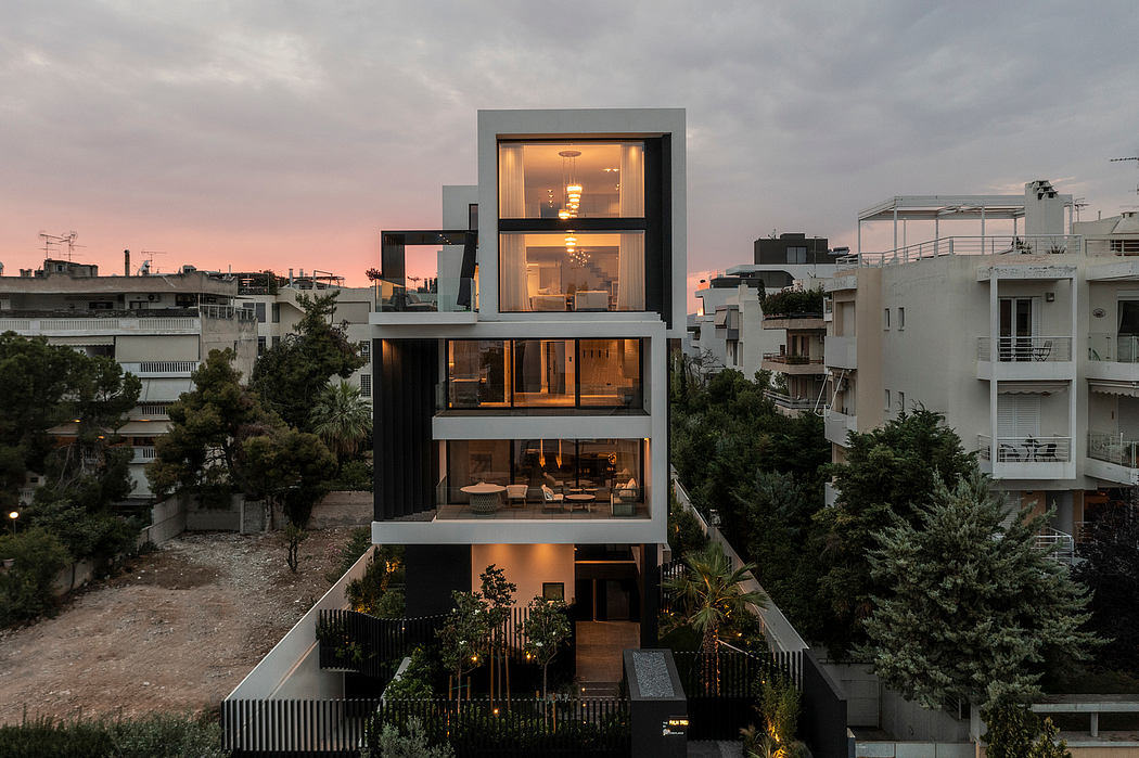 A modern, multi-level home with large windows, wood accents, and a scenic urban backdrop.