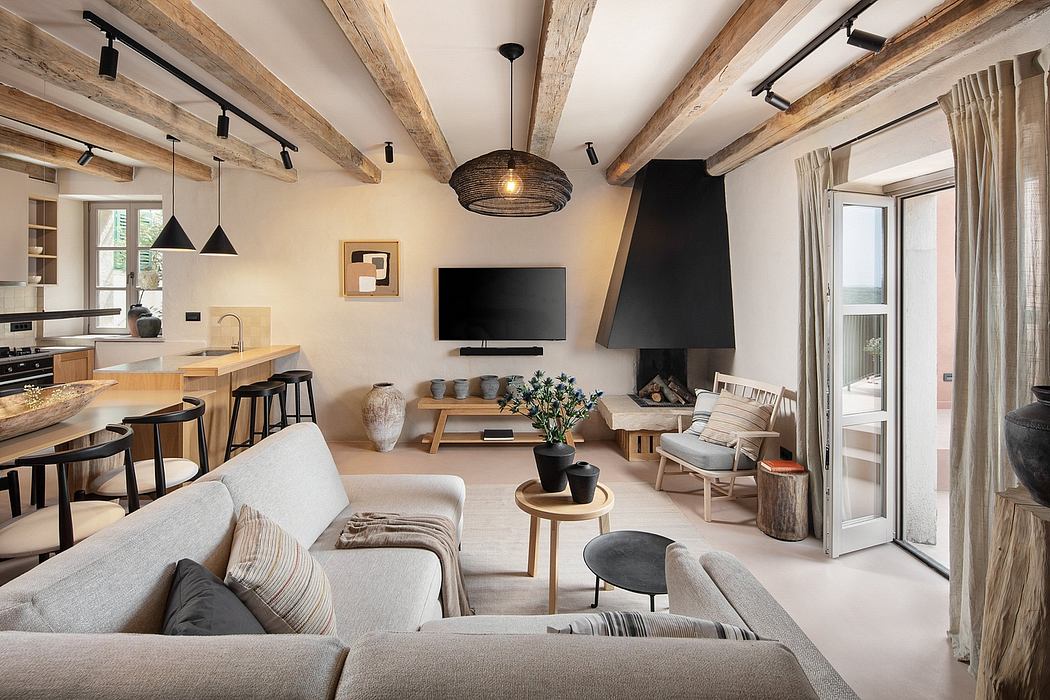 Cozy, rustic-style apartment with exposed wooden beams, modern furniture, and a fireplace.