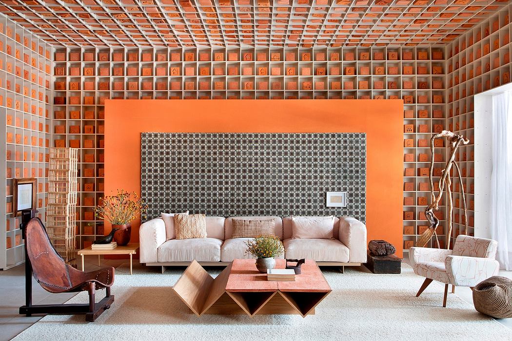 A modern, minimalist living space with a vibrant orange accent wall and geometric furniture.