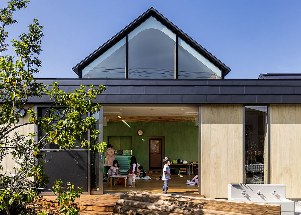 Striking triangular roofline with expansive glass facade and integration of nature.