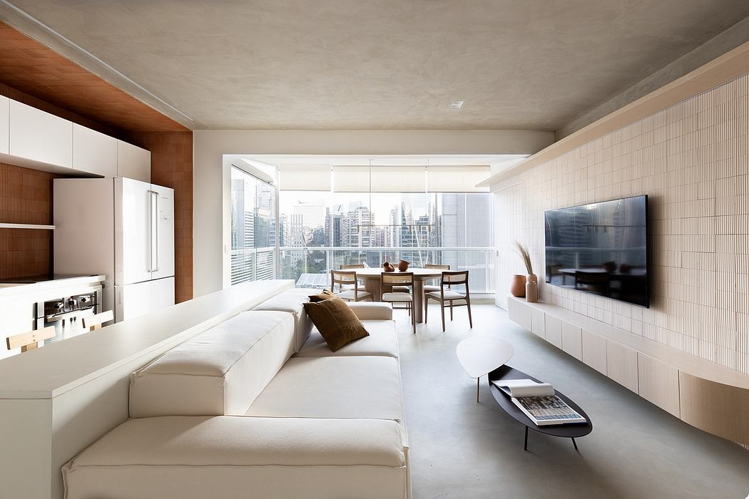 Modern, open-plan apartment showcasing sleek interior design, panoramic city view.