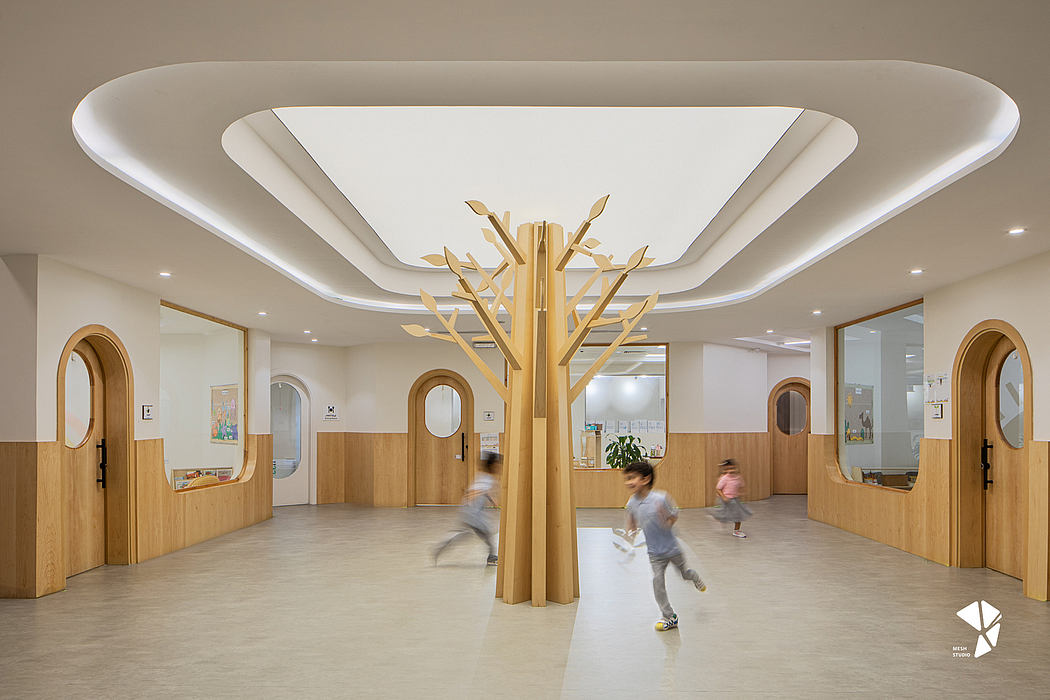 Expansive, open lobby with minimalist design, wooden architectural elements, and a striking decorative tree sculpture.
