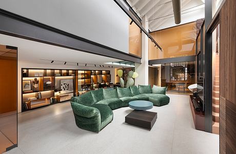 Expansive living room with modern furniture, shelves, and lighting fixtures.