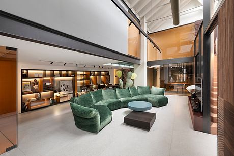 Expansive living room with modern furniture, shelves, and lighting fixtures.