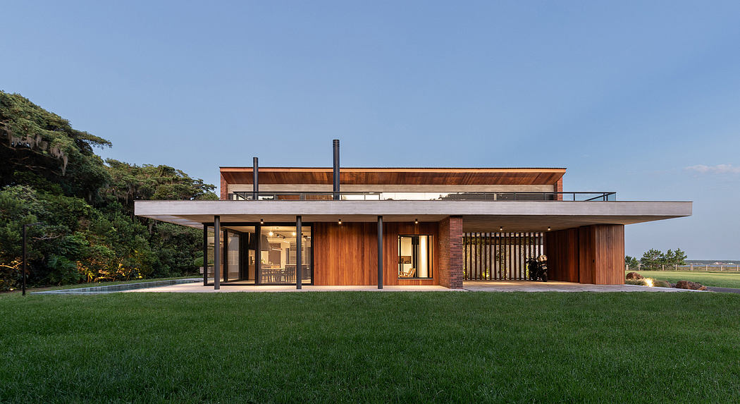A modern, single-story home with a prominent wooden facade, expansive windows, and a covered patio.