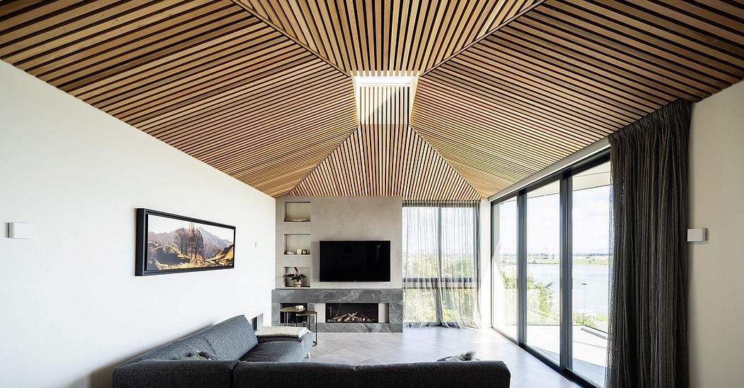 Striking wooden ceiling design and expansive glass windows highlight the modern interior.
