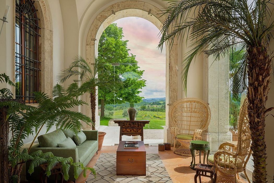 Ornate stone archway frames lush garden vista, with eclectic furnishings and abundant greenery.