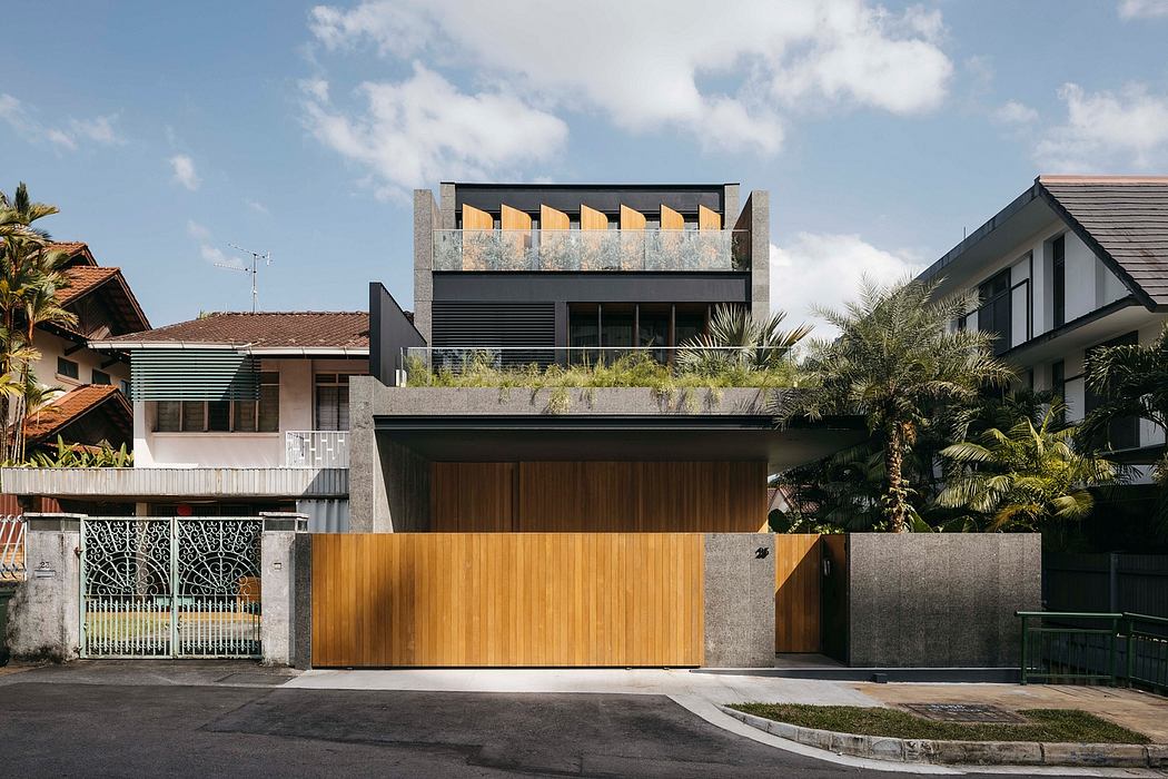 Striking modern architecture with wooden accents, greenery, and a raised rooftop structure.
