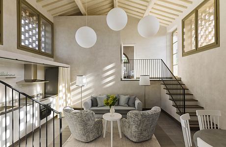 Cozy rustic living space with vaulted wooden ceiling, pendant lighting, and modern furniture.