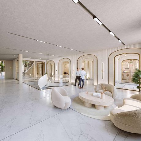 Modern marble lobby with arched entryways, curved furnishings, and tall column details.