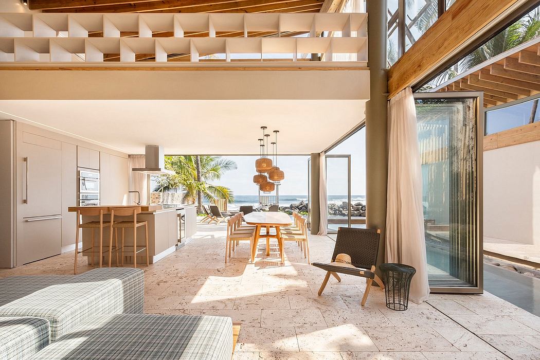 A bright, airy beach house interior with wooden accents, open layout, and stunning ocean views.