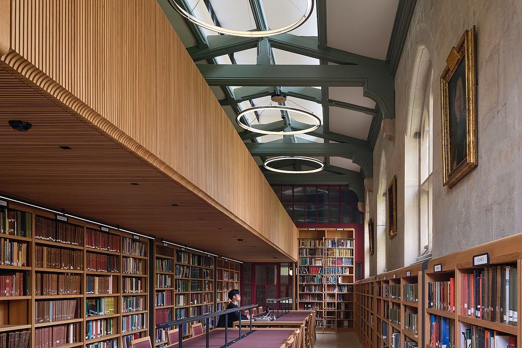 A grand, wood-paneled library with a vaulted glass ceiling and rows of bookshelves.