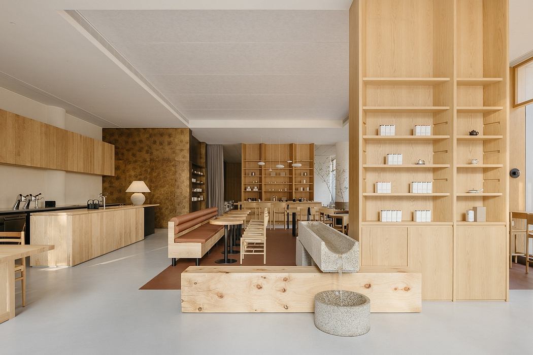 A modern, minimalist interior design with wooden shelving, seating, and countertops.