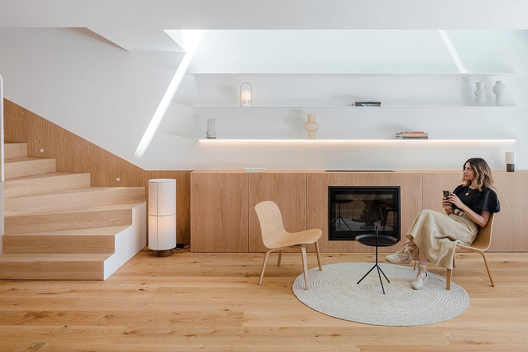 A modern, minimalist living space with clean lines, warm wood accents, and recessed lighting.