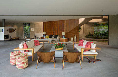 Expansive open-plan living area with warm wood accents, modern furniture, and abundant natural light.