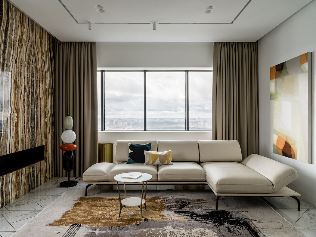 Sleek modern living room with floor-to-ceiling windows, plush neutral sofa, and abstract art.