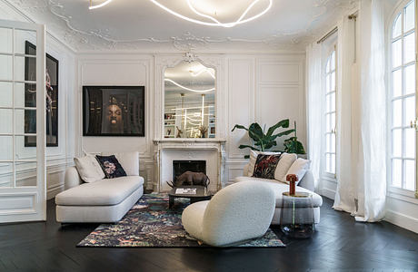 Ornate, light-filled room with luxurious furnishings and architectural details.