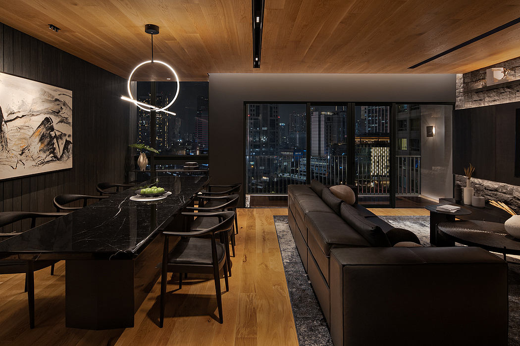 Captivating modern loft with sleek furnishings, dramatic lighting, and breathtaking city view.