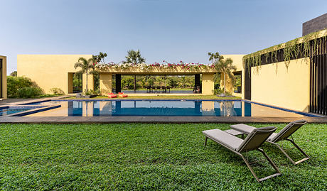 Serene oasis with infinity pool, lush greenery, and contemporary architectural elements.