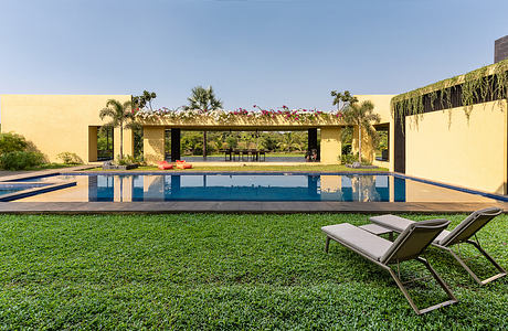 Serene oasis with infinity pool, lush greenery, and contemporary architectural elements.