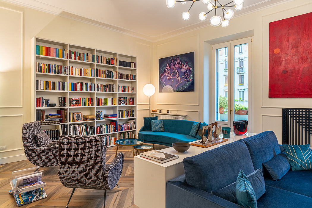 Spacious living room with floor-to-ceiling bookshelves, plush seating, and modern decor.