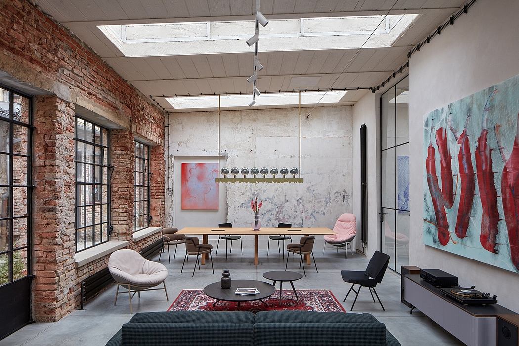 A modern industrial-style loft with exposed brick walls, high ceilings, and artistic decor.