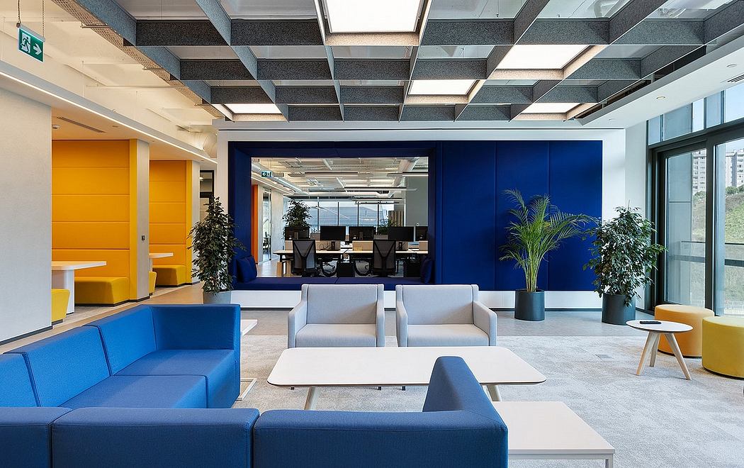Modern, open-concept office with vibrant colors, modular furniture, and ample natural light.