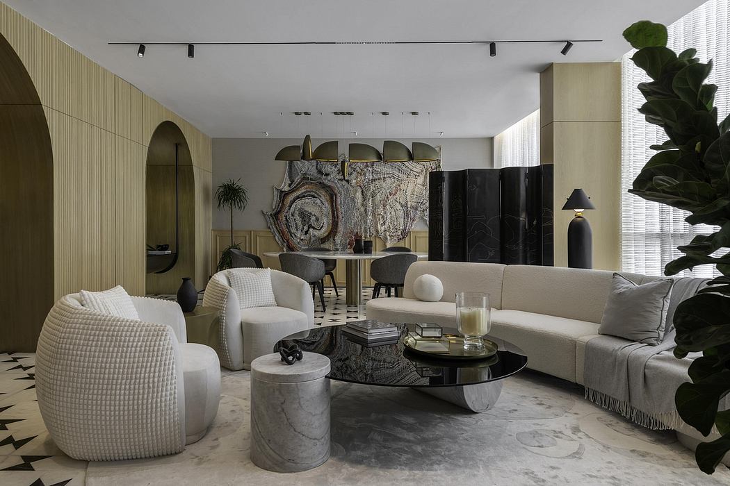 Stylish modern living room with arched entryways, gray furniture, and a statement artwork.