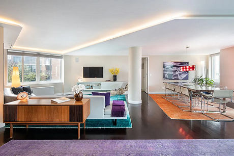 Spacious, modern living room with vibrant colors and striking design elements.