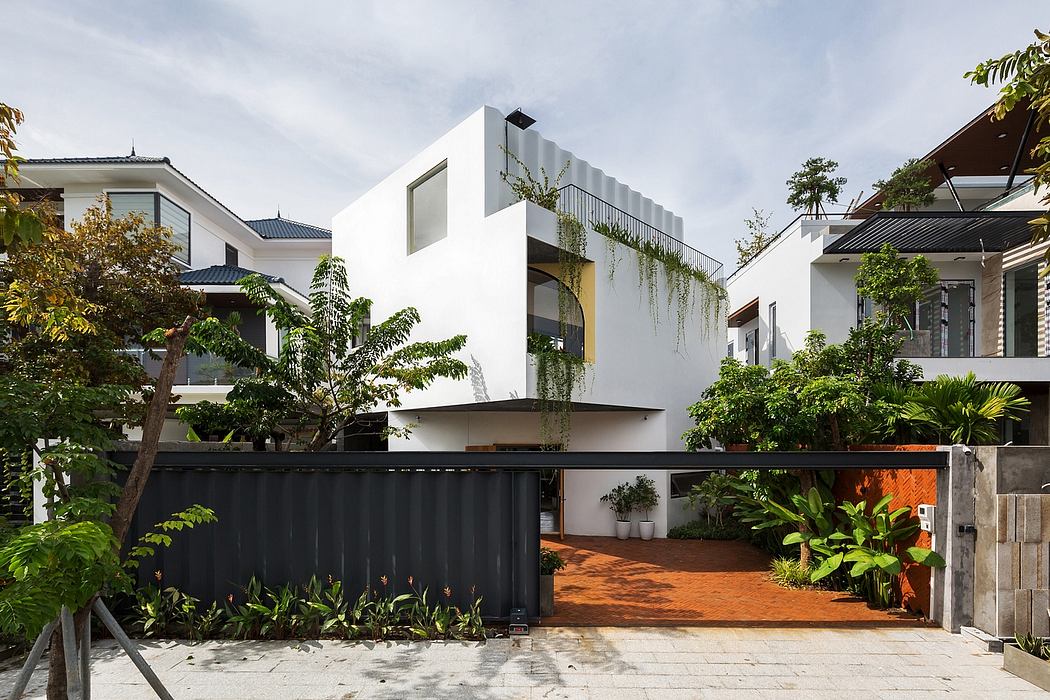 Stunning modern architecture with lush tropical landscaping and unique design elements.