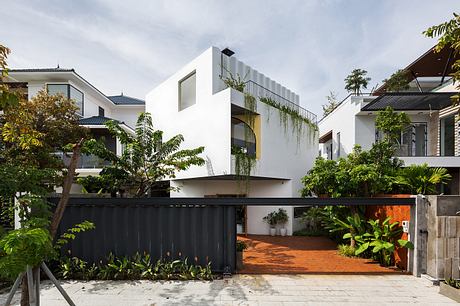 Stunning modern architecture with lush tropical landscaping and unique design elements.