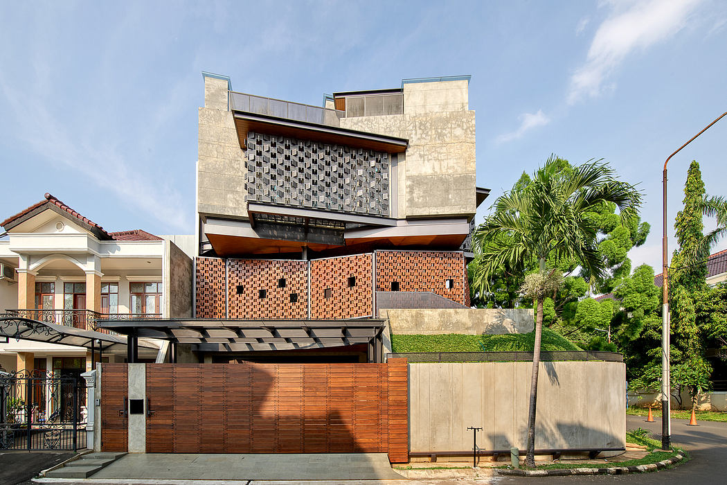 Modern architectural design with intriguing brick pattern and wooden accents, surrounded by lush greenery.