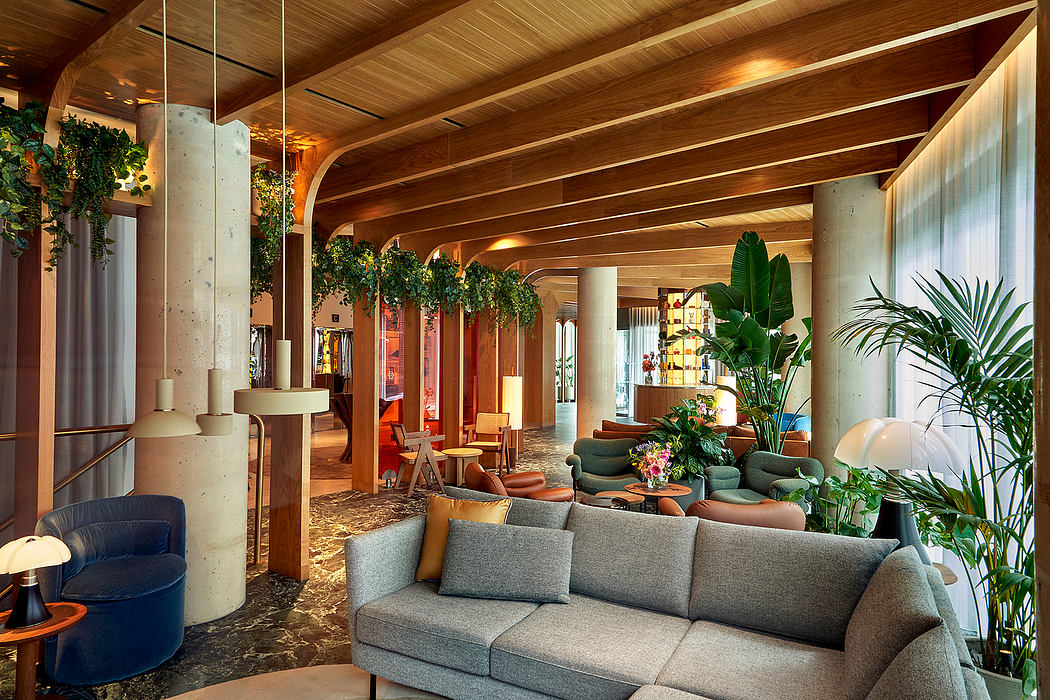 Spacious, rustic-chic lobby with wooden beams, greenery, and plush seating areas.