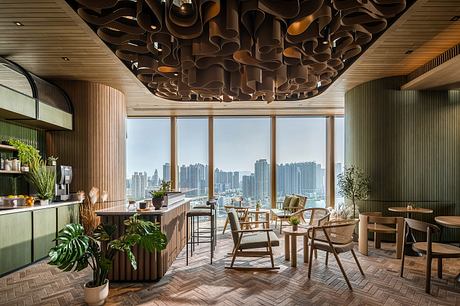 Stunning modern interior with wooden accents, potted plants, and panoramic city views.