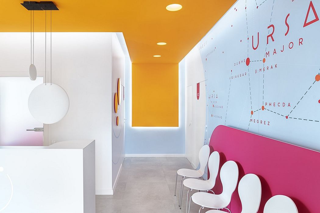 Vibrant orange hallway with geometric lighting fixtures and a stylized wall map.