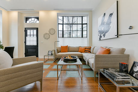 Bright, modern interior with architectural details, geometric accents, and neutral furnishings.