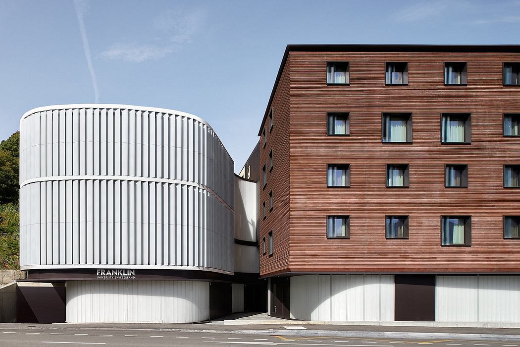 Striking modern architecture featuring curved white facade and wood-paneled building.