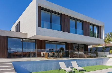 Modern, sleek house with clean lines, large windows, pool, and landscaped yard.