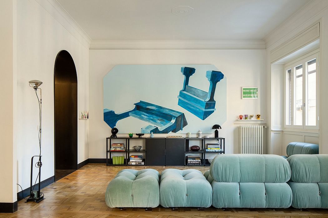 Stylish contemporary living room with vibrant teal sofa, shelving, and bold artwork.