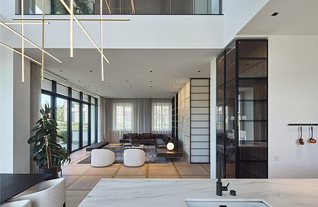 A modern, open-concept living space with clean lines, natural lighting, and minimalist decor.