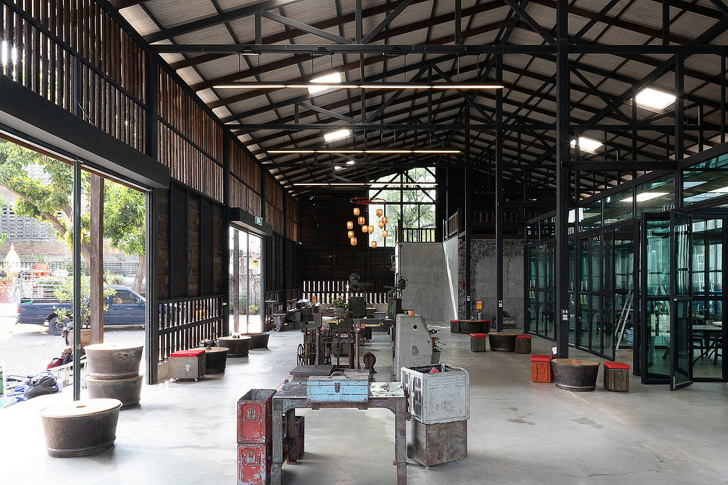 Large open industrial space with metal framing, exposed ceilings, and vintage decor.