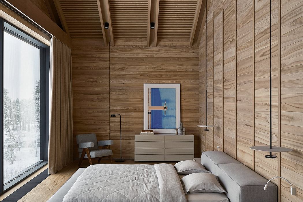 A cozy, wood-paneled bedroom with a large window overlooking a snowy landscape.