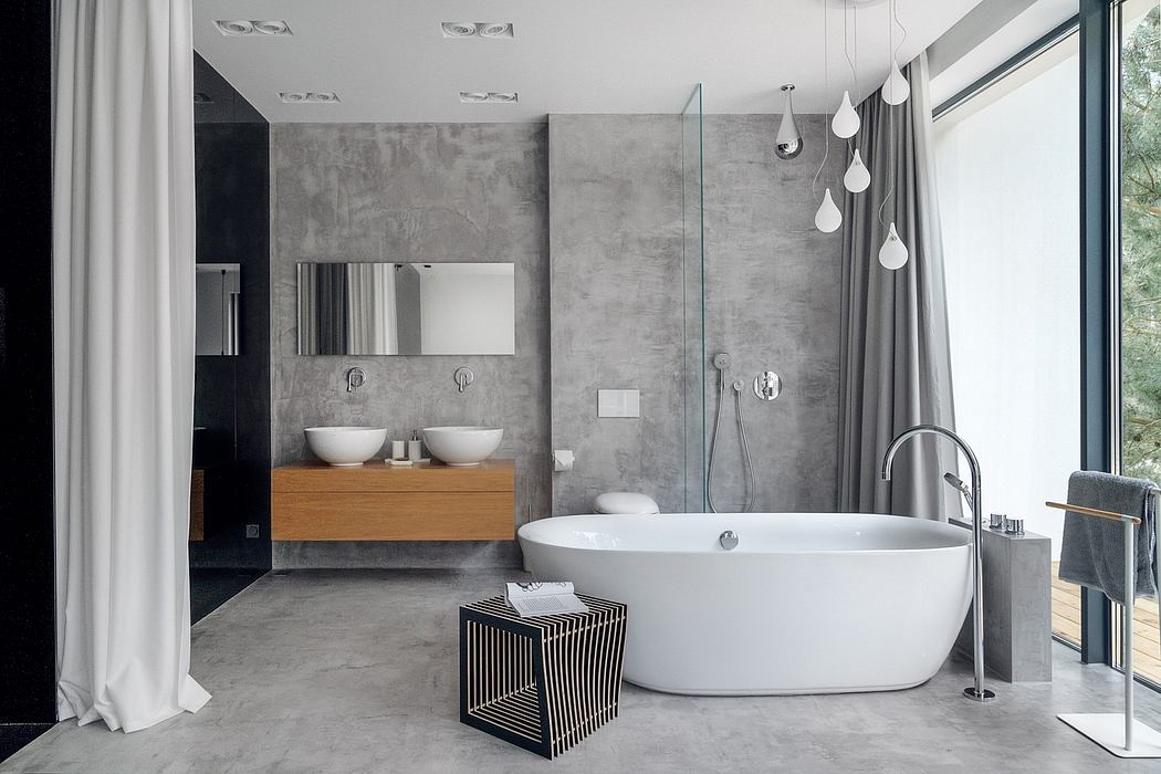 Modern minimalist bathroom design with concrete walls, freestanding tub, dual vanity.