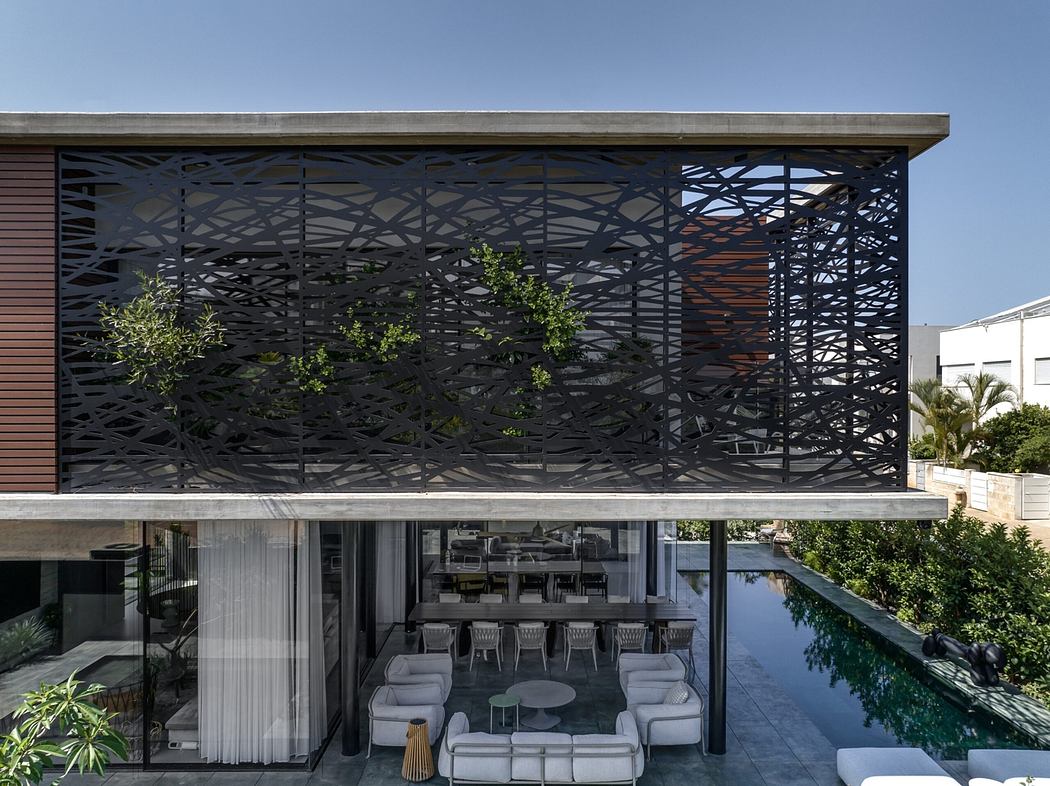 Dramatic metal lattice facade, minimalist interior with pool, sleek furniture design.