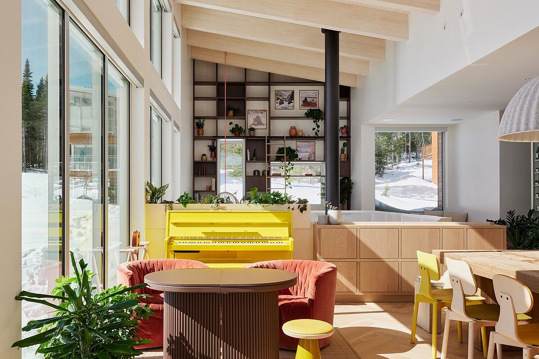 A spacious, modern interior with bright yellow piano, pink couch, and wooden shelving.