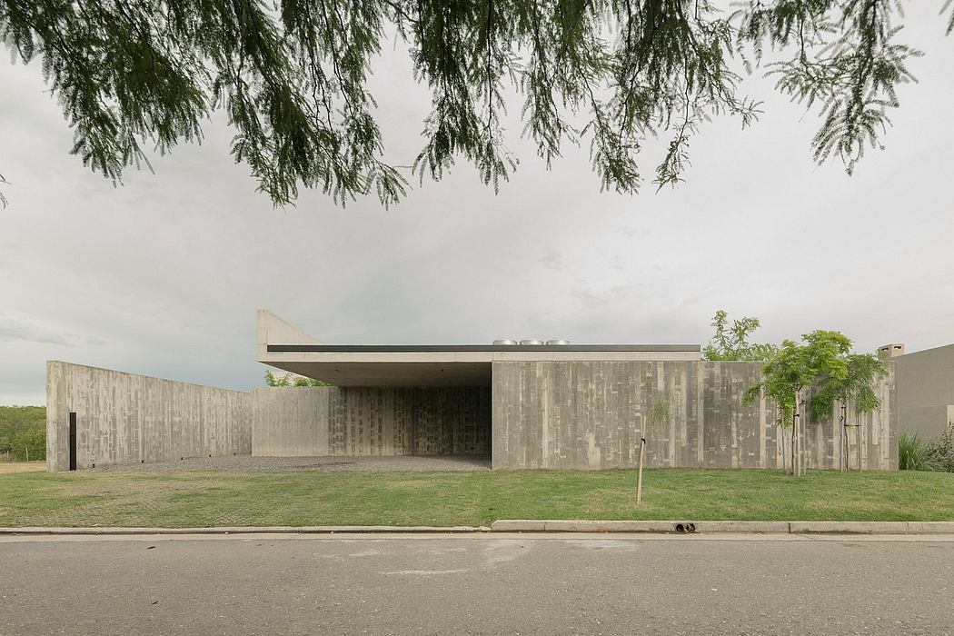 Striking modernist concrete building with clean architectural lines and natural surroundings.