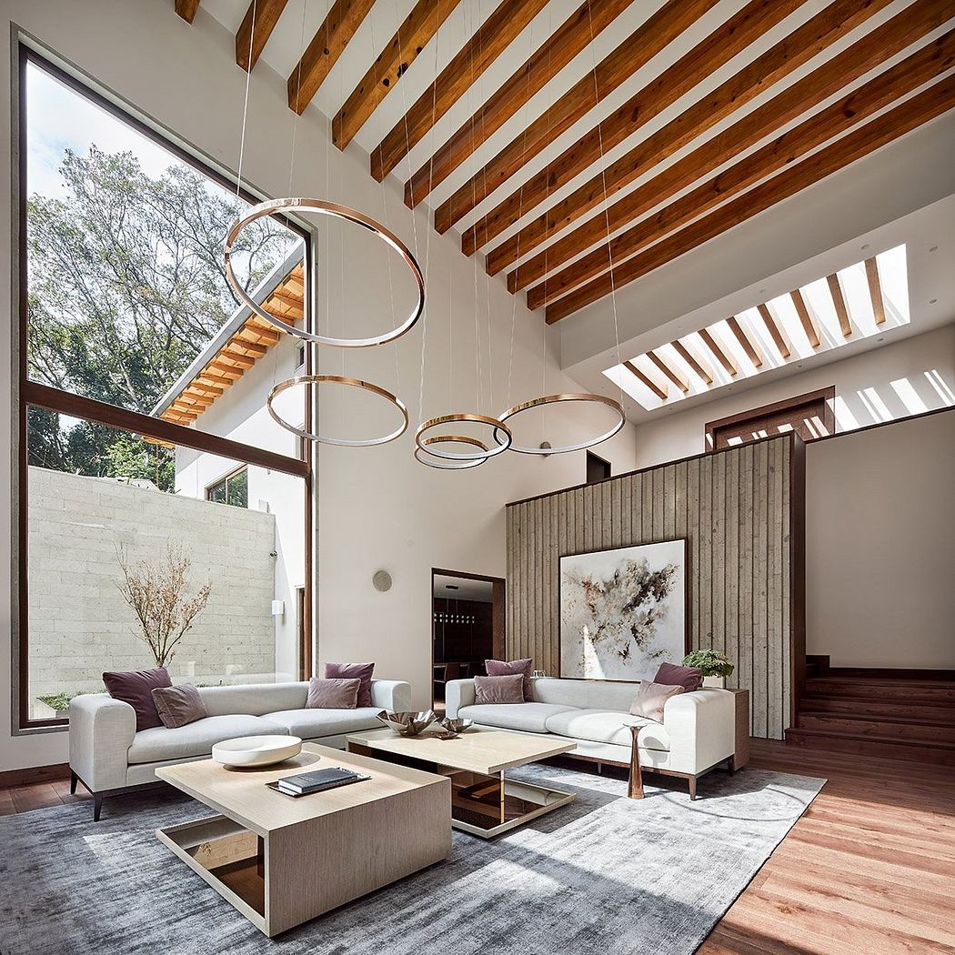 Luxurious modern living room with sleek wooden beams, circular lighting fixtures, and an expansive window.